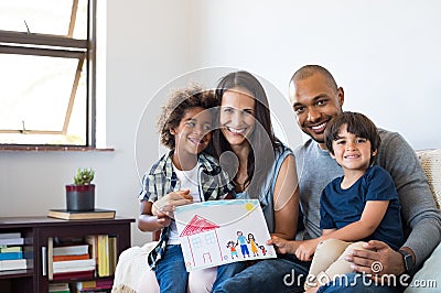 Multiethnic family on sofa Stock Photo